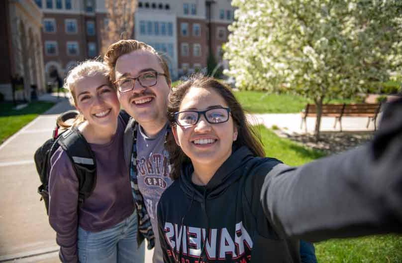 Students pose for a selfie-style photo