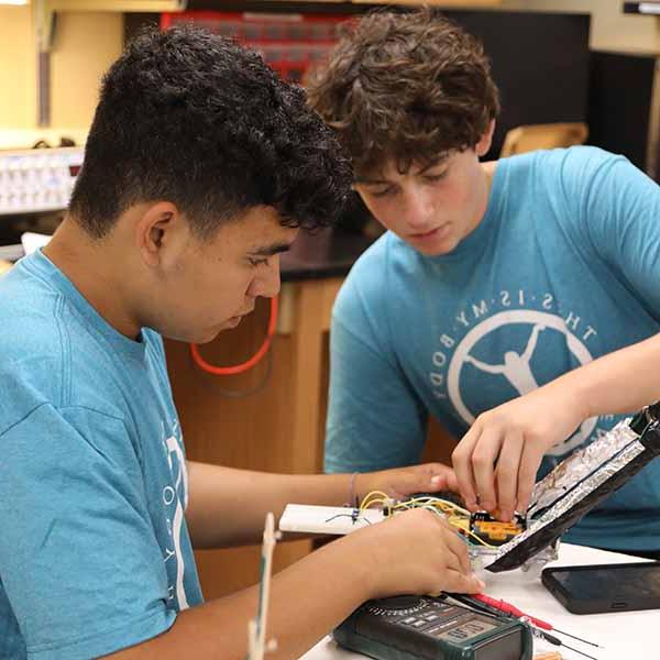 Two BCYC Immersion engineering track students wiring a project 