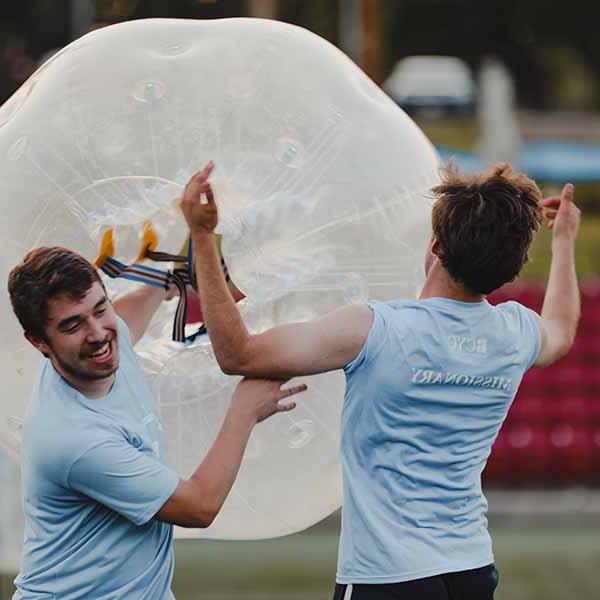 BCYC close up of two students in a game with inflatable bubble-soccer ball 