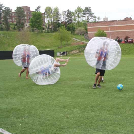 Students playing bubble soccer